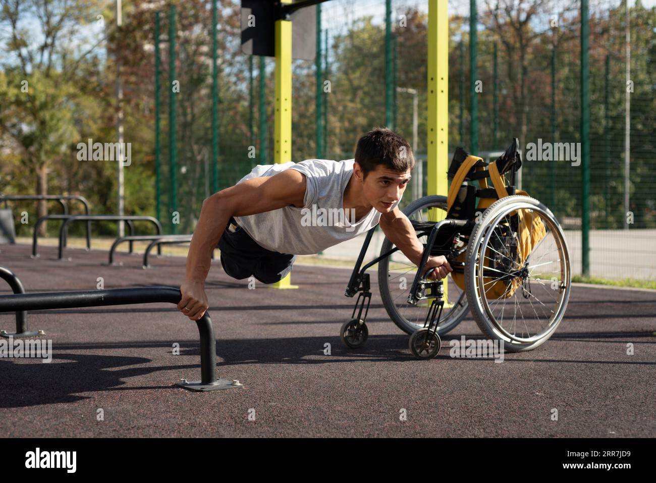 Full shot disabled man doing push ups Stock Photo