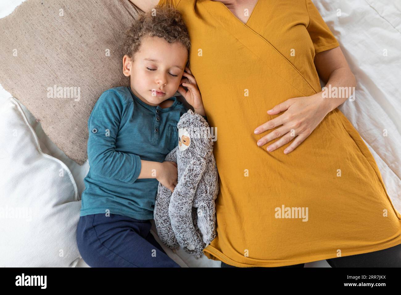 Little boy sleeping his mother Stock Photo
