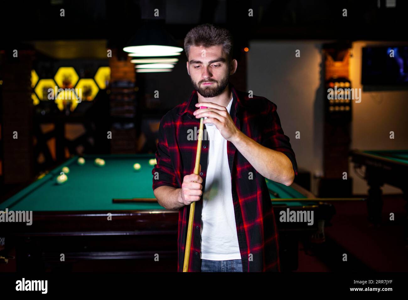 Medium shot guy with pool cue chalk Stock Photo Alamy