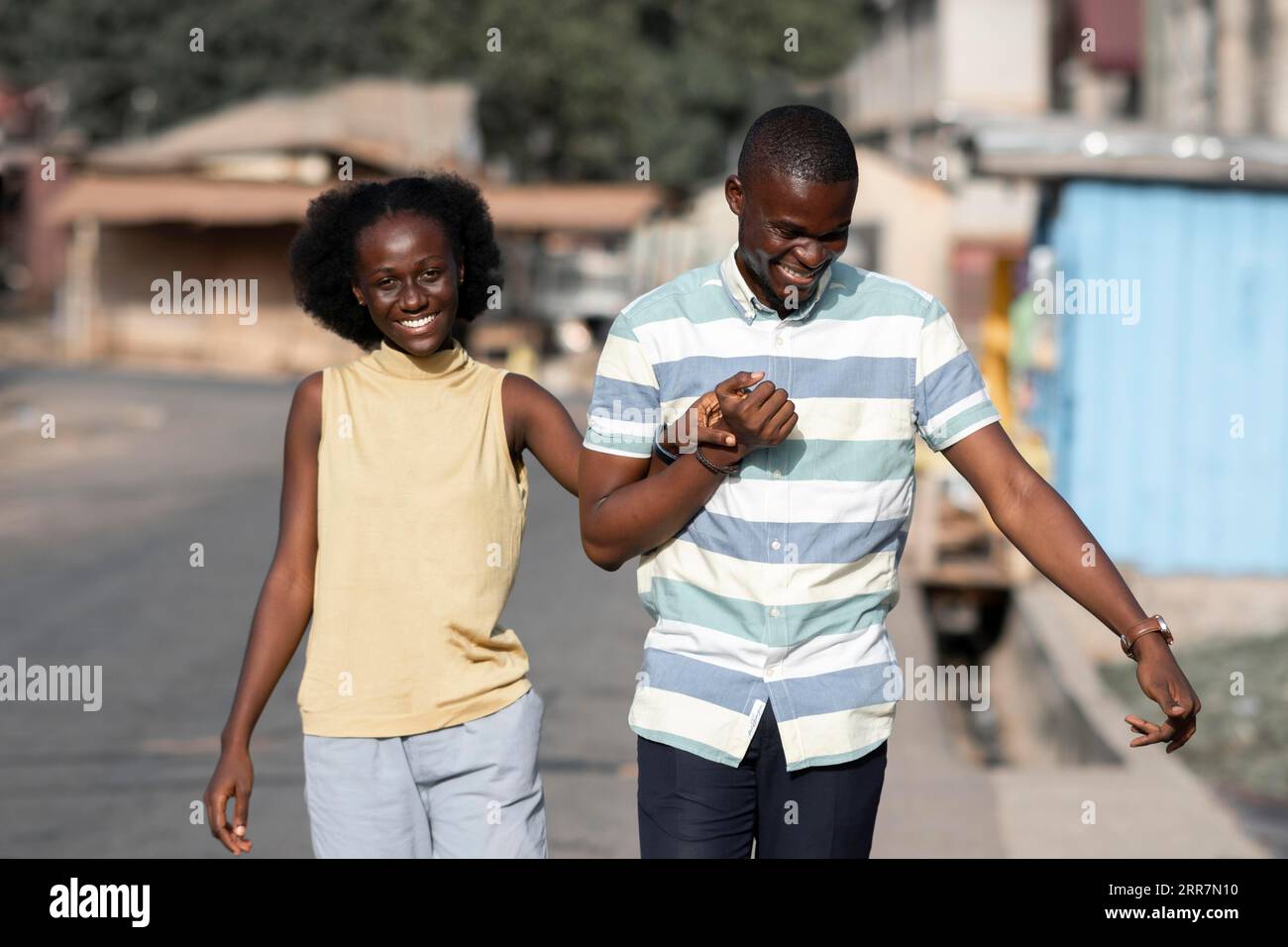 Medium shot african couple holding hands Stock Photo - Alamy