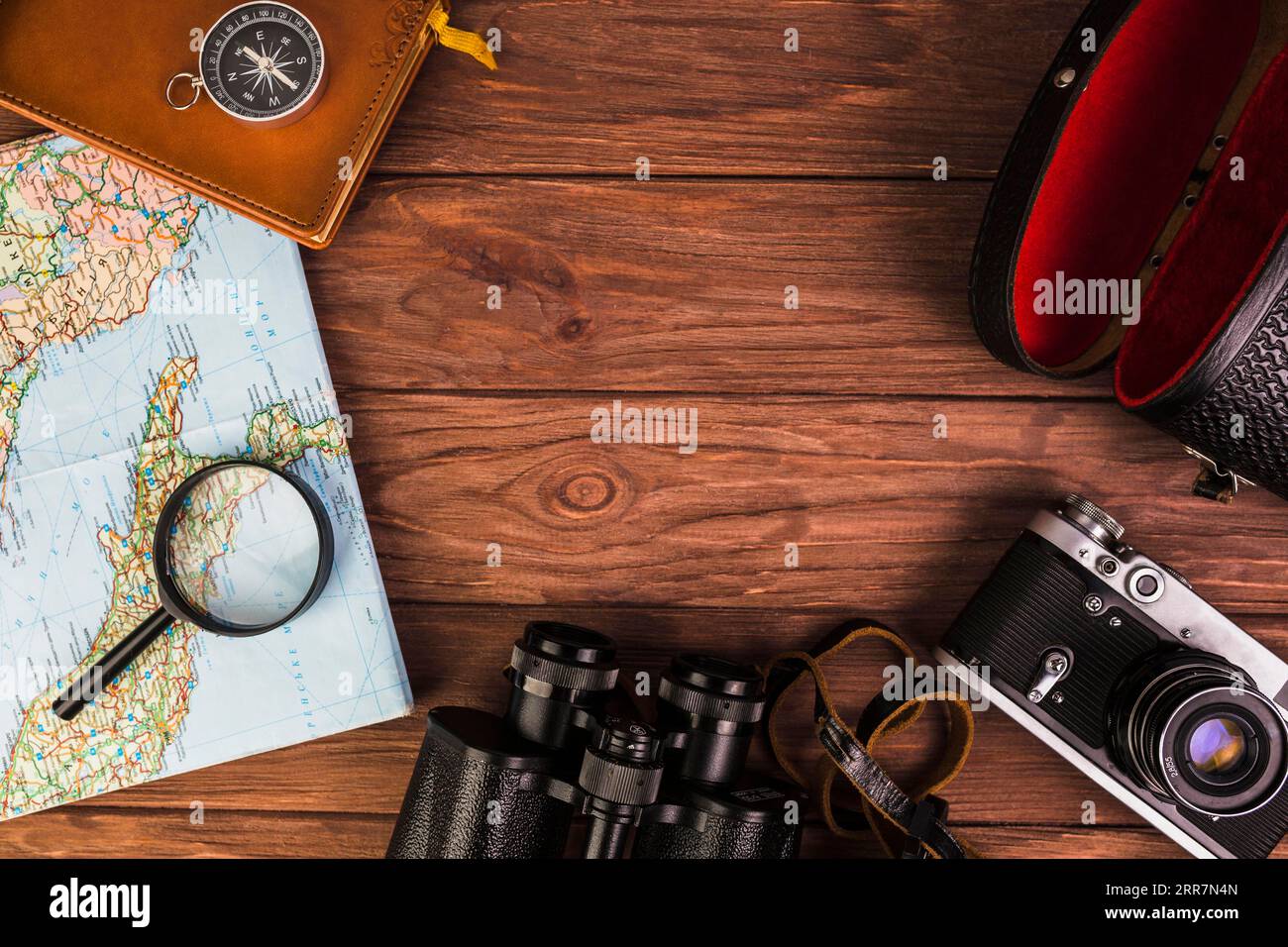 Old fashionable travel stuff wooden table Stock Photo