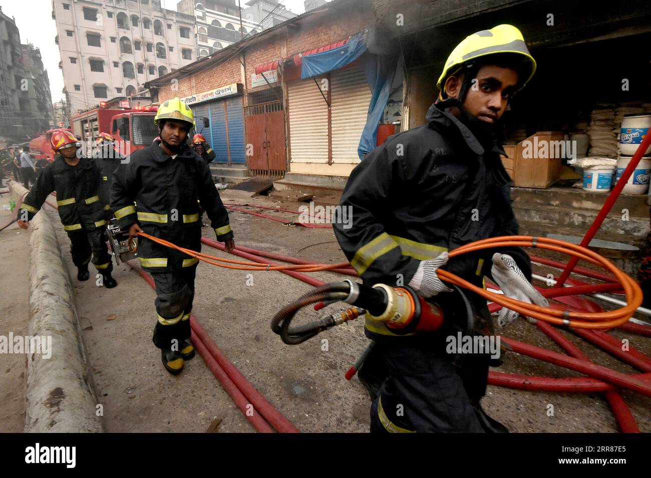 210423 DHAKA, April 23, 2021 Firefighters try to extinguish the