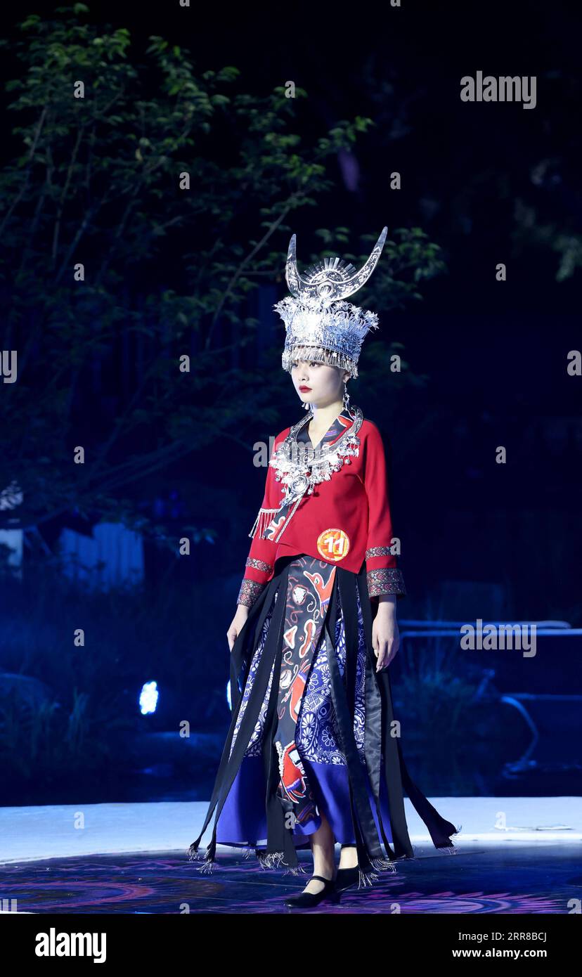 210429 -- TONGLU, April 29, 2021 -- A model presents a creation during a design exhibition featuring indigenous style in Eshan Ethnic Village of Tonglu County, east China s Zhejiang Province, April 28, 2021.  CHINA-ZHEJIANG-TONGLU-DESIGN EXHIBITION CN ChenxJianli PUBLICATIONxNOTxINxCHN Stock Photo