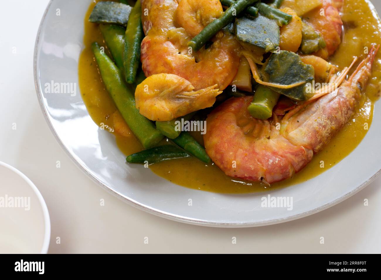 Ginisang gulay with hipon at kalabasa. Sauteed vegetables with shrimp and pumpkin. Stock Photo