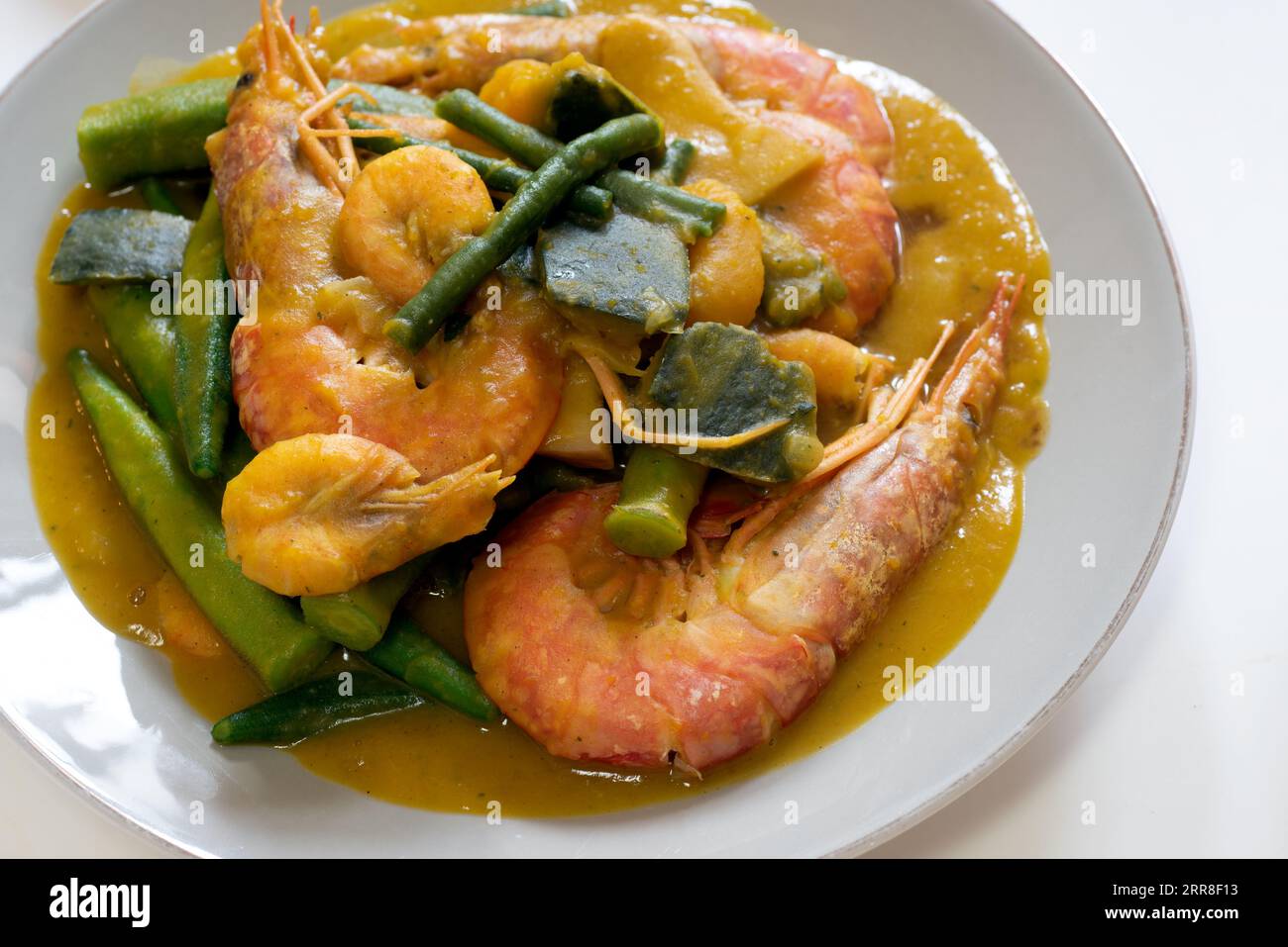 Ginisang gulay with hipon at kalabasa. Sauteed vegetables with shrimp and pumpkin. Stock Photo
