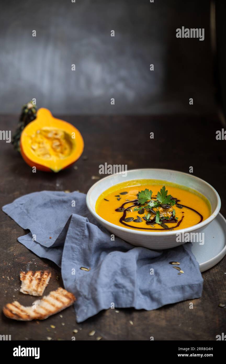 A Bowl Of Rich And Creamy Pumpkin Soup Made With Organic Hokkaido 