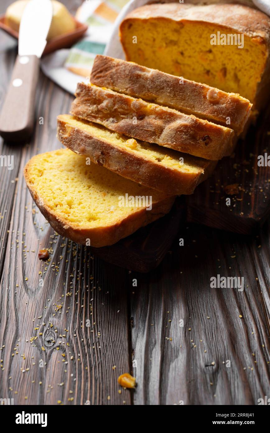 https://c8.alamy.com/comp/2RR8J41/homemade-cornbread-slices-and-butter-on-kitchen-table-2RR8J41.jpg