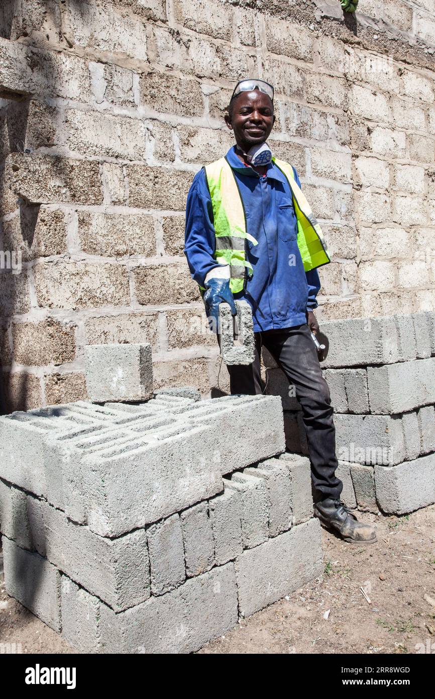 210518 LUSAKA, May 18, 2021 Charles Tembo poses for a photo with