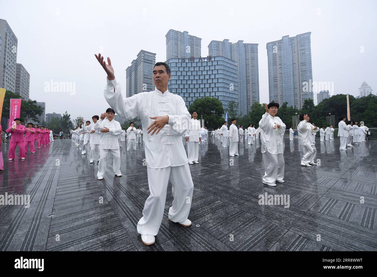 210519 -- TONGLU, May 19, 2021 -- Senior hobbyists of Taijiquan, a traditional Chinese martial art, demonstrate Taijiquan moves by Fuchunjiang River in Tonglu County, east China s Zhejiang Province, on May 19, 2021. A nation-wide campaign to promote and demonstrate Taijiquan as a fitness exercise among senior citizens was launched here on Wednesday. More than 2,000 Taijiquan hobbyists from all over the country flocked in to participate in the demonstrations and performances.  CHINA-ZHEJIANG-TONGLU-TAIJIQUAN FITNESS EXERCISESCN XuxYu PUBLICATIONxNOTxINxCHN Stock Photo