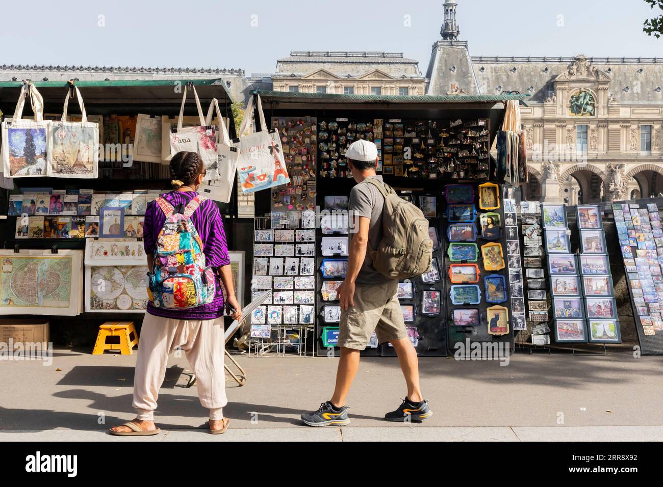 September 6, 2023, Paris, France, France: Paris, France September 6, 2023 -  Tourists pass by a book stall. Threatened with having to pack up for the  time of the 2024 Olympic Games,