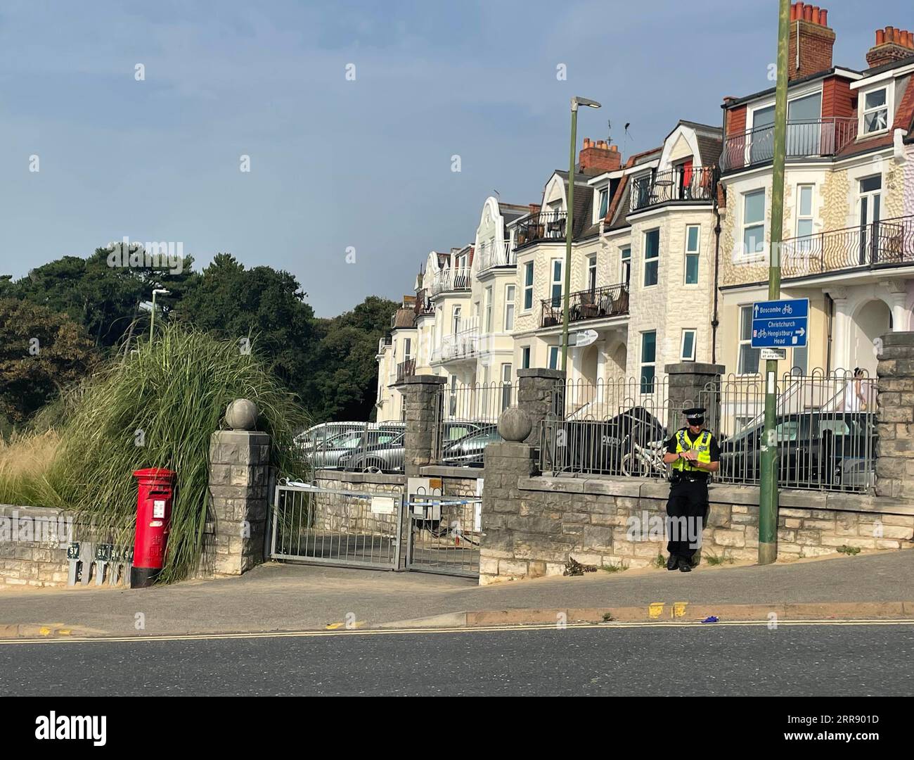 A police officer is near the scene at Chine Gardens by