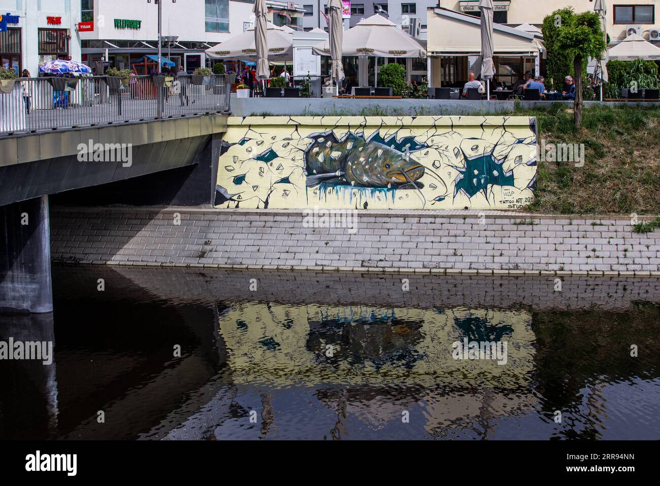 210528 -- VUKOVAR, May 28, 2021 -- A mural is seen on the river bank in Vukovar, Croatia, May 27, 2021. Street art festival VukovART, which features murals created by world-famous artists on the walls and sidewalks, is held in Vukovar for the fifth year in a row. /Pixsell via Xinhua CROATIA-VUKOVAR-STREET ART-MURALS DavorxJavorovic PUBLICATIONxNOTxINxCHN Stock Photo