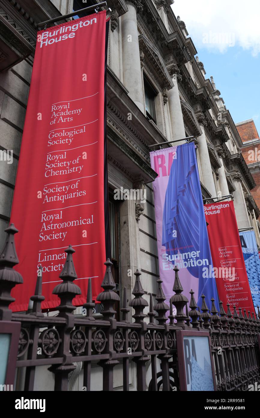 Banners outside Burlington House, including The Royal Academy Summer Exhibition, London, UK. Stock Photo