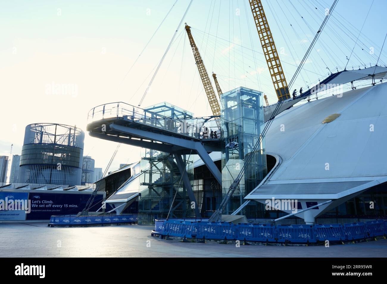 London, UK, External View of  The O2 Entrance, showing visitors on the roof climb. Stock Photo