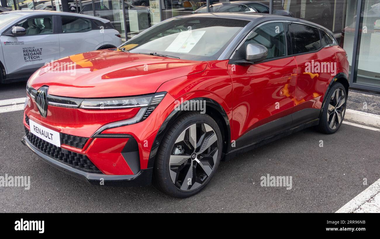 Pau , France - 09 06 2023 : renault megane e-tech logo and text sign brand  of red electric car parked in dealership Stock Photo - Alamy