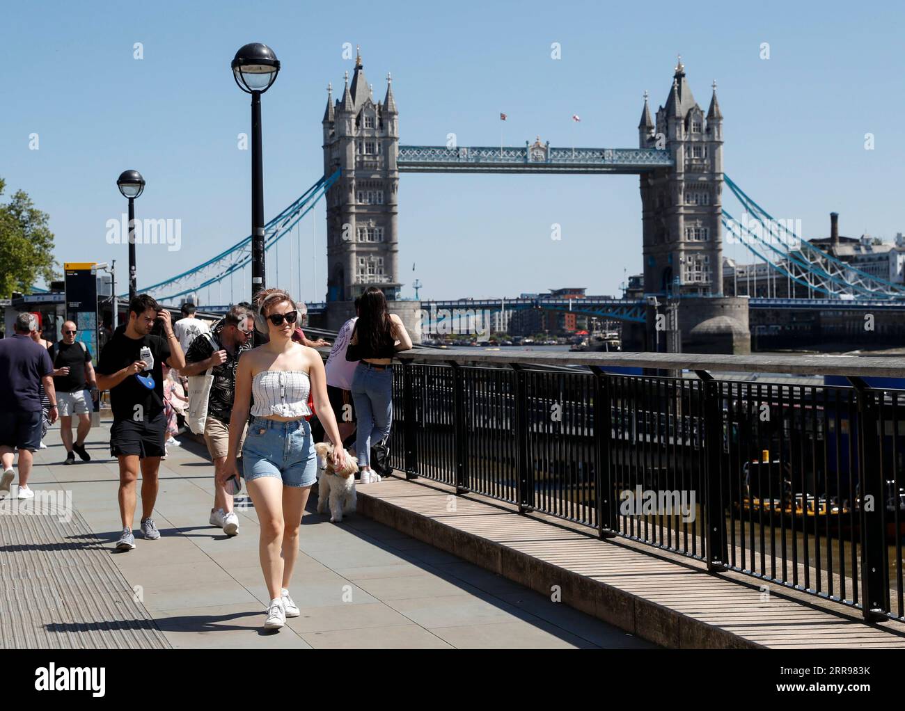 210602 -- LONDON, June 2, 2021 -- People walk along the River Thames, backdropped by the Tower Bridge, in London, Britain, June 1, 2021. Britain remains in a vulnerable position in fighting coronavirus despite the progress of the country s vaccination program, a scientist advising the British government said Tuesday. Professor Adam Finn from the Joint Committee on Vaccination and Immunisation, which advises the government on vaccine priority, said the job to contain the pandemic is not done as large numbers of people are still unvaccinated.  BRITAIN-LONDON-COVID-19 HanxYan PUBLICATIONxNOTxINxC Stock Photo