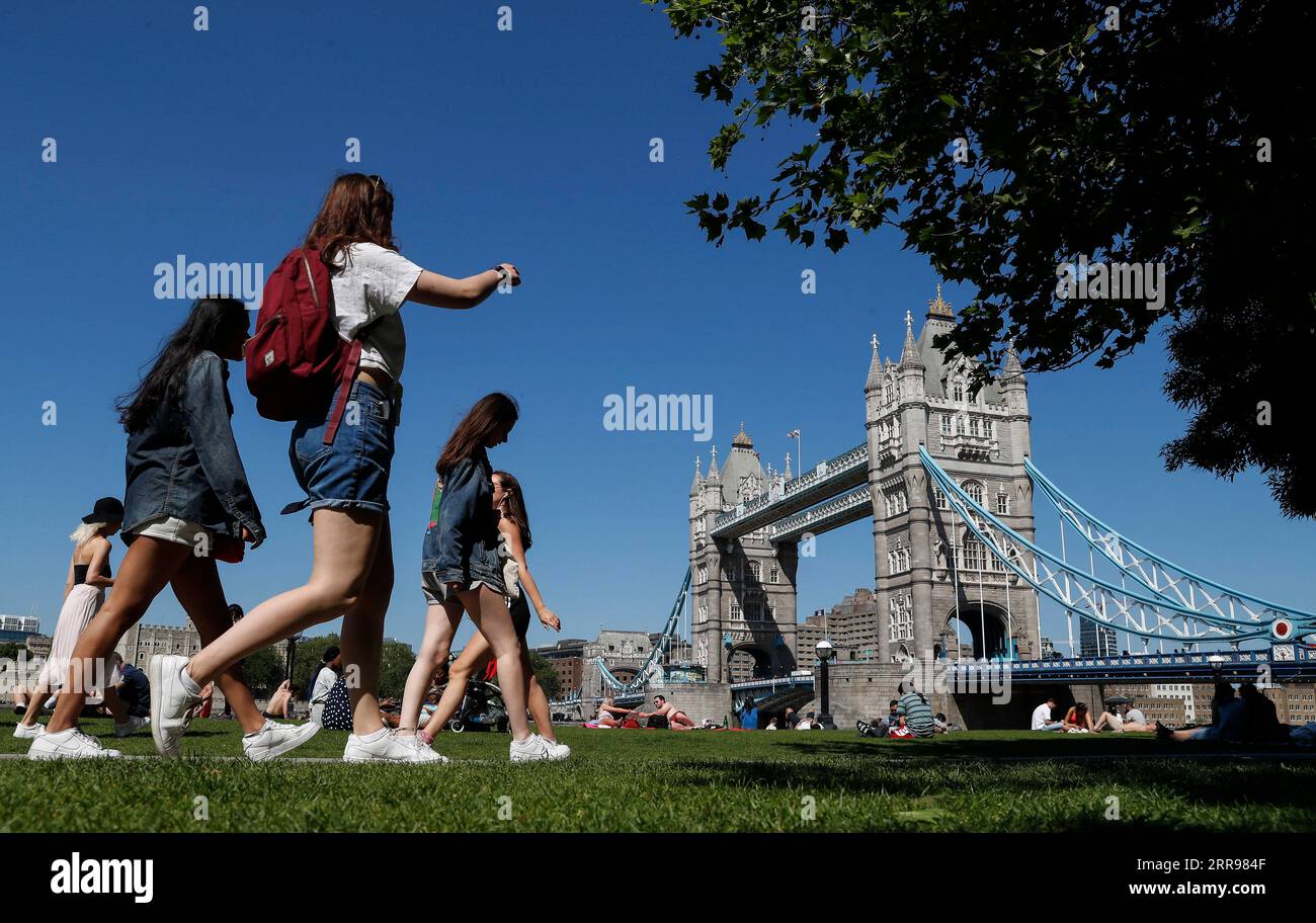 210602 -- LONDON, June 2, 2021 -- People walk at Potters Fields Park in front of the Tower Bridge in London, Britain, June 1, 2021. Britain remains in a vulnerable position in fighting coronavirus despite the progress of the country s vaccination program, a scientist advising the British government said Tuesday. Professor Adam Finn from the Joint Committee on Vaccination and Immunisation, which advises the government on vaccine priority, said the job to contain the pandemic is not done as large numbers of people are still unvaccinated.  BRITAIN-LONDON-COVID-19 HanxYan PUBLICATIONxNOTxINxCHN Stock Photo