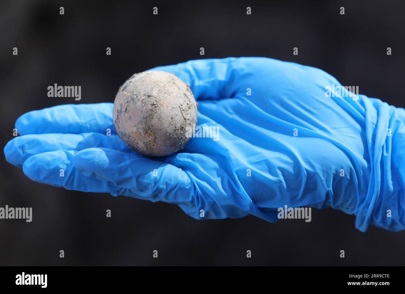 210609 -- YAVNE ISRAEL, June 9, 2021 -- An Israeli archeologist shows an intact chicken s egg of roughly 1,000 years ago in Yavne, central Israel, on June 9, 2021. Israeli archeologists have discovered an intact chicken s egg of roughly 1,000 years ago, the Israel Antiquities Authority IAA said Wednesday. The egg was found in an excavation site in Yavne, in a cesspit dating from the Islamic period. Photo by /Xinhua ISRAEL-YAVNE-ARCHEOLOGY-EGG GilxCohenxMagen PUBLICATIONxNOTxINxCHN Stock Photo