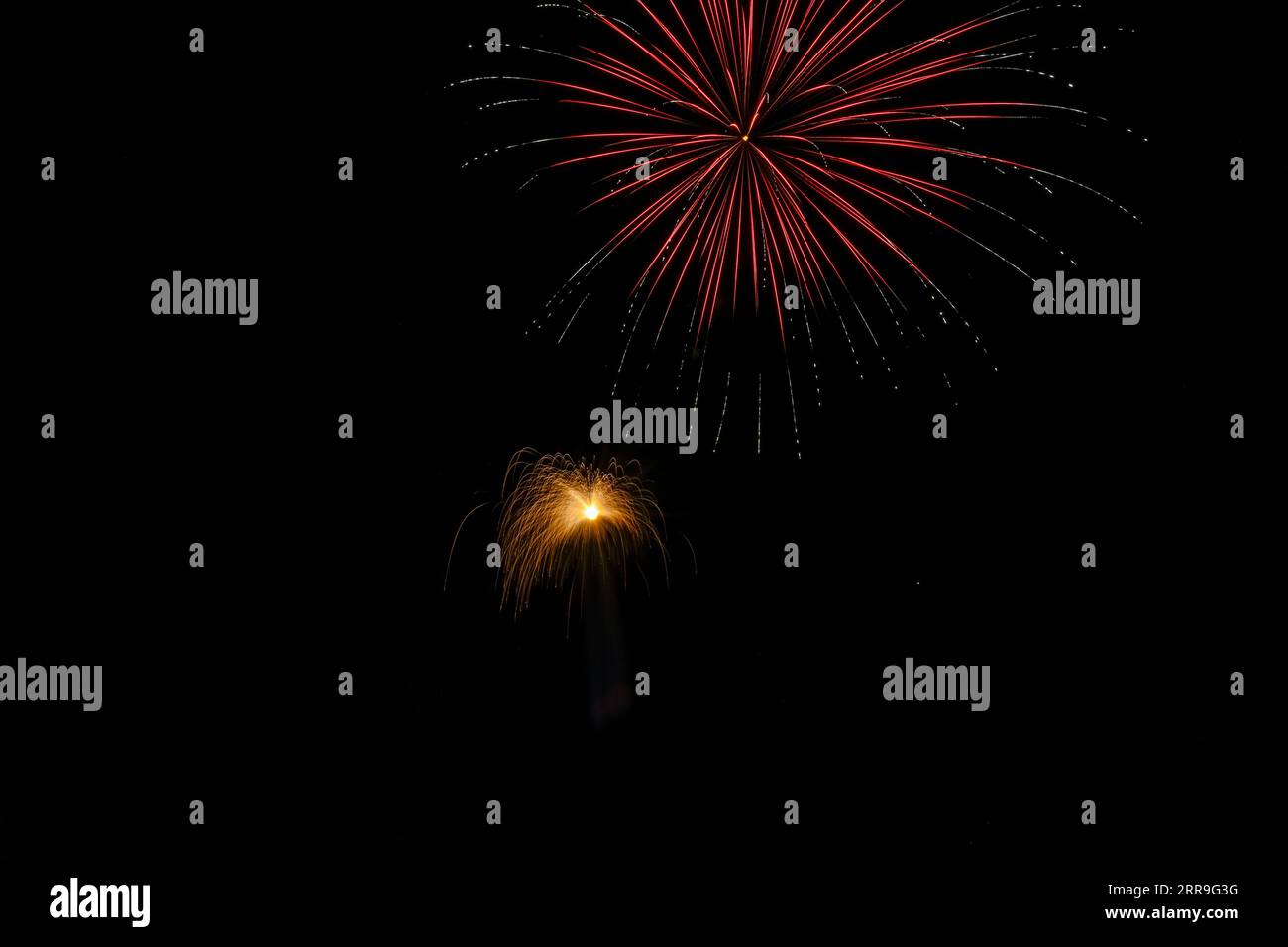 Colorful fireworks exploded in the night sky Stock Photo - Alamy