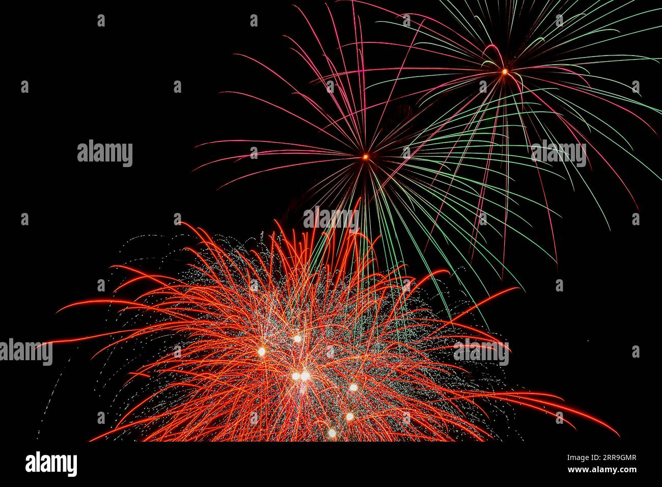 Colorful fireworks exploded in the night sky Stock Photo - Alamy