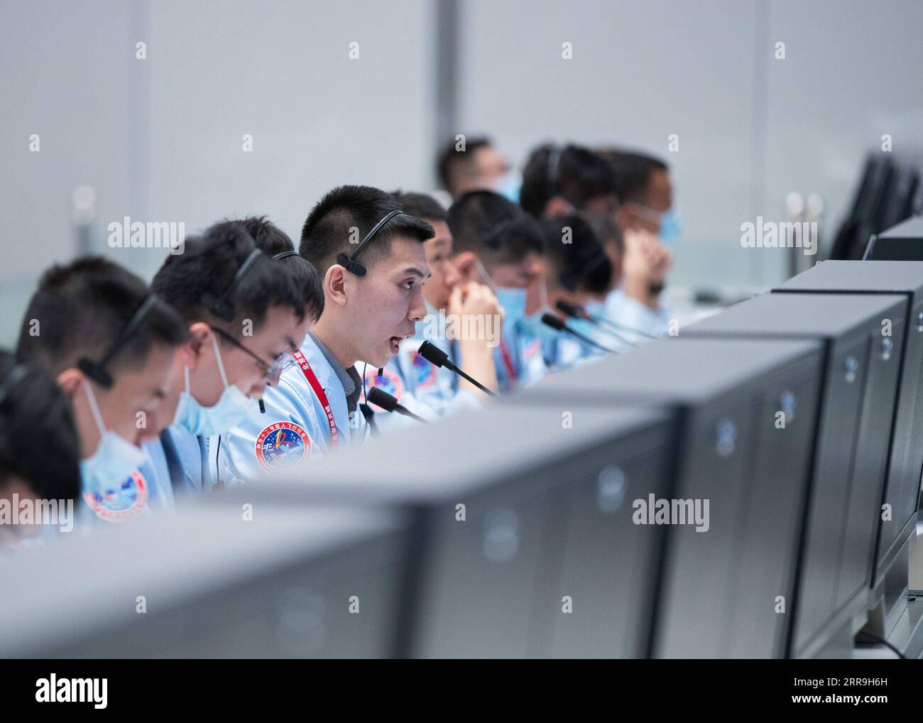 210617 -- BEIJING, June 17, 2021 -- Technical personnel monitor China s Shenzhou-12 manned spaceship docking with the space station core module Tianhe at Beijing Aerospace Control Center in Beijing, capital of China, June 17, 2021. China s Shenzhou-12 manned spaceship has successfully docked with the space station core module Tianhe on Thursday, according to the China Manned Space Agency CMSA. The spaceship, launched on Thursday morning, completed orbital status setting after entering the orbit and conducted a fast autonomous rendezvous and docking with the front docking port of Tianhe at 3:54 Stock Photo