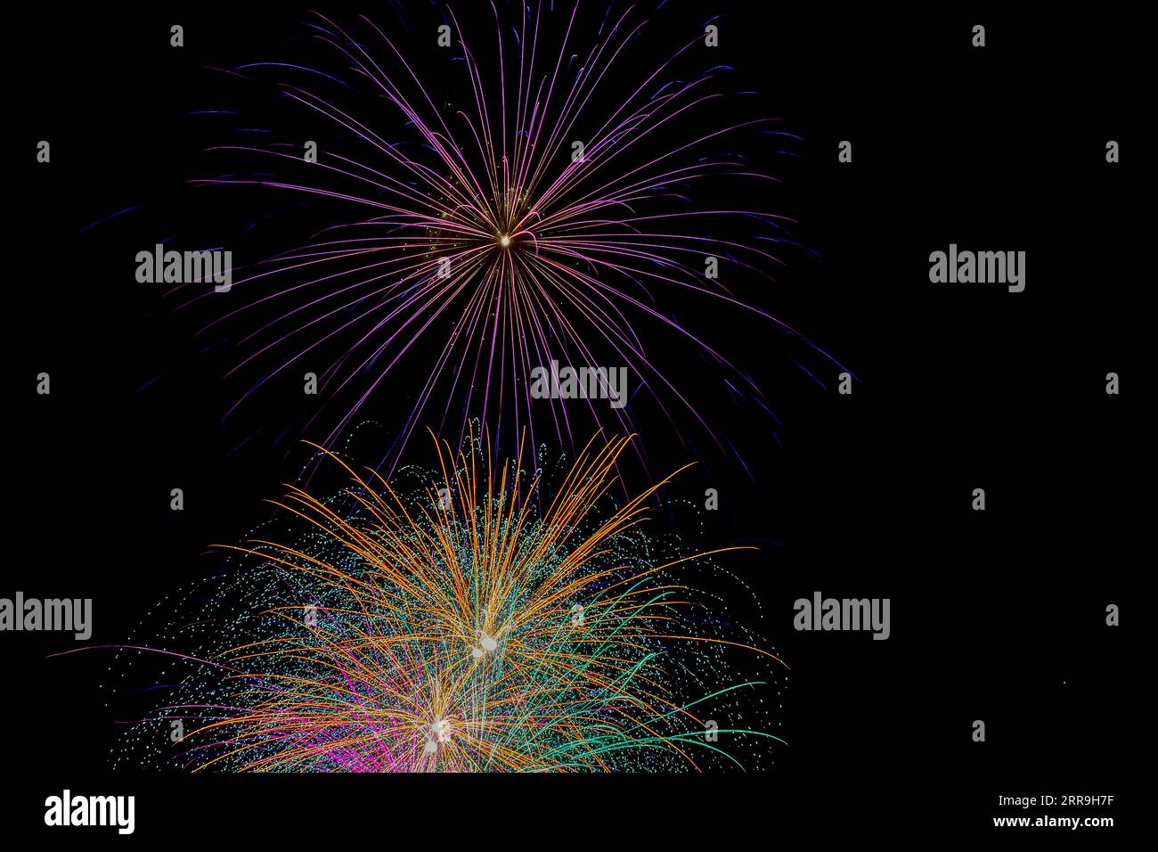 Colorful fireworks exploded in the night sky Stock Photo - Alamy