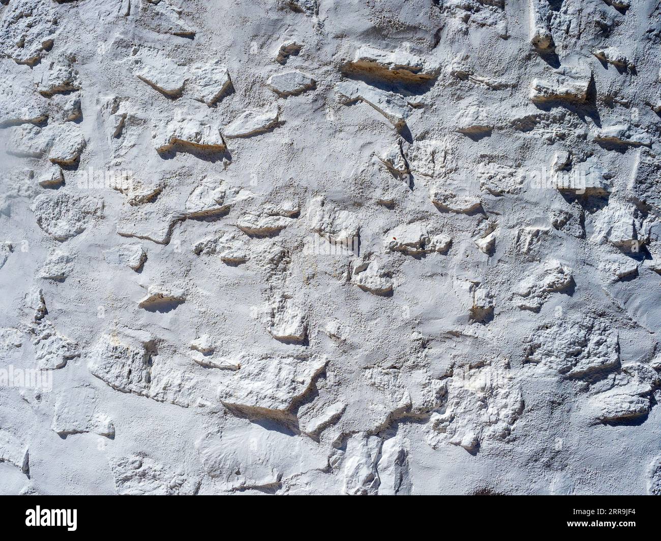 Rustic cement wall painted white Stock Photo