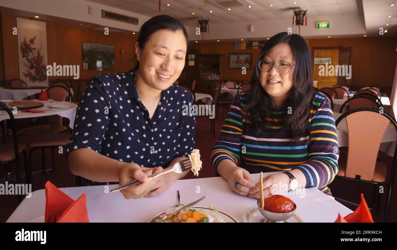 210621 -- SYDNEY, June 21, 2021 -- Lin Jie Kong L, director of Chopsticks or Fork , and Jennifer Wong, hostess of the program, sample a dish at the New Bo Wa Restaurant in Moree in northern New South Wales, Australia, on Oct. 21, 2020. TO GO WITH Feature: Chinese-Australian entertainer s TV program lovingly looks at life s sweet, sour moments AUSTRLIA-SYDNEY-CHINESE CUISINE-TV PRESENTER TeresaxTan PUBLICATIONxNOTxINxCHN Stock Photo