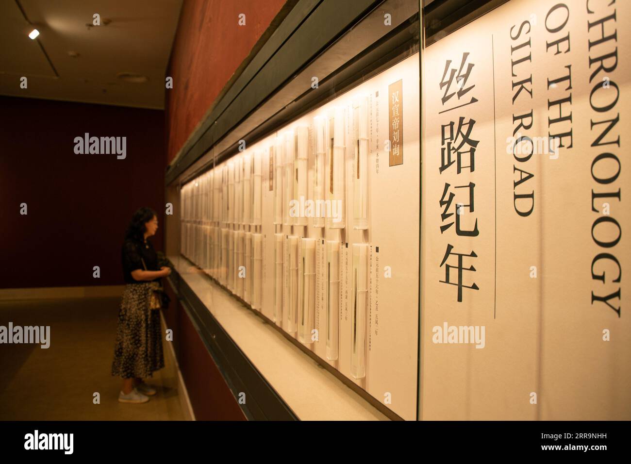 230907 -- LANZHOU, Sept. 7, 2023 -- A visitor views exhibits at the new  hall of Gansu bamboo slip museum in Lanzhou, northwest China s Gansu  Province, Sept. 7, 2023. The new