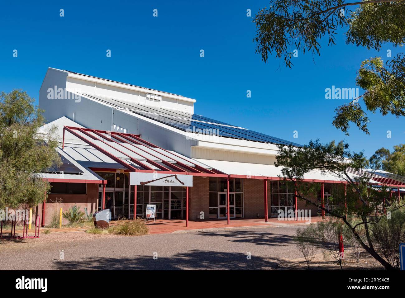 Solar panels on the roof of the Araluen Arts Centre near Alice Springs (Mparntwe) in the Northern Territory, Australia Stock Photo