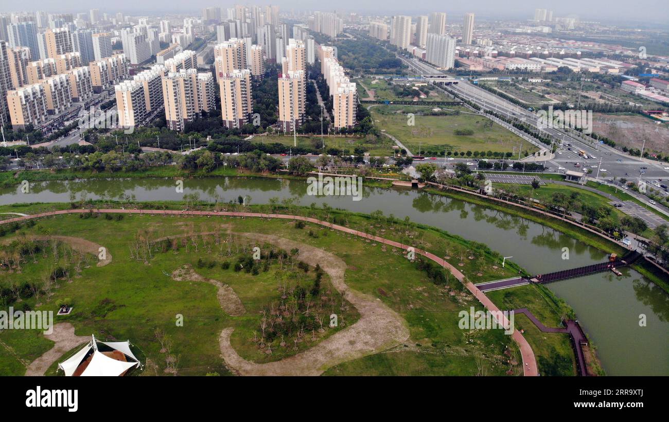 210707 -- CANGZHOU, July 7, 2021 -- Aerial photo taken on July 6, 2021 shows a view along the Grand Canal in Cangzhou City of north China s Hebei Province. Authorities in Cangzhou City has been actively promoting the Grand Canal culture by improving scenery along the watercourse so that visitors may have close experience with its beauty.  CHINA-HEBEI-CANGZHOU-GRAND CANAL-SCENERY CN LuoxXuefeng PUBLICATIONxNOTxINxCHN Stock Photo