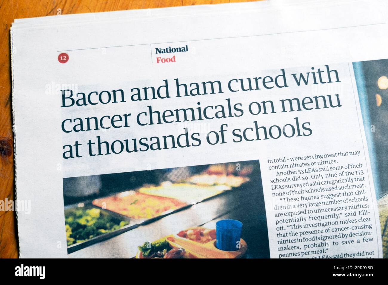 'Bacon and ham cured with cancer chemicals on menu at thousands of schools' Guardian newspaper headline school food article 2 September 2023 London UK Stock Photo