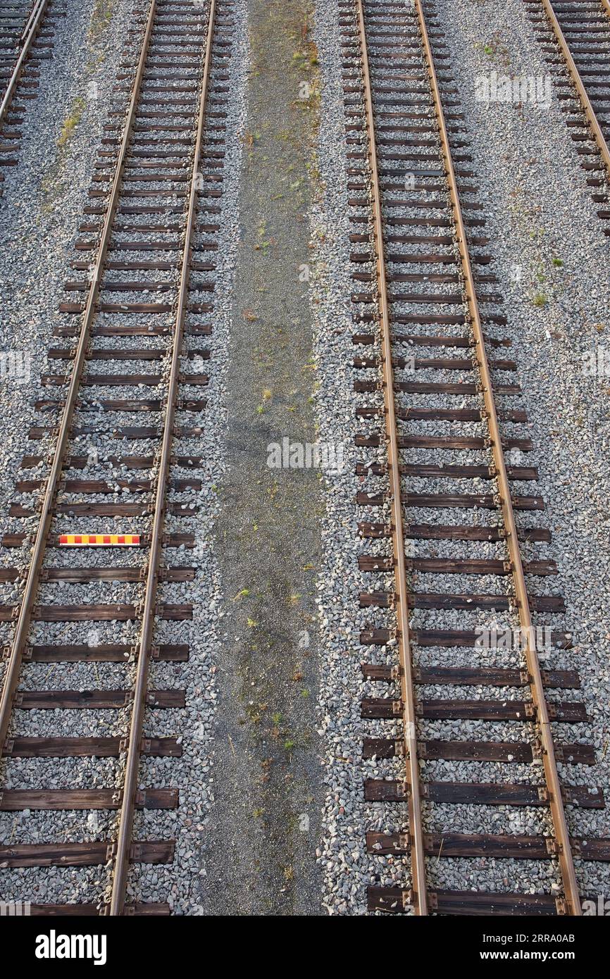 old railroad tracks with wooden baulks Stock Photo