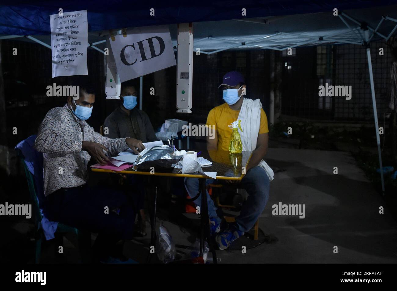 210709 DHAKA, July 9, 2021 Staff members collect information of