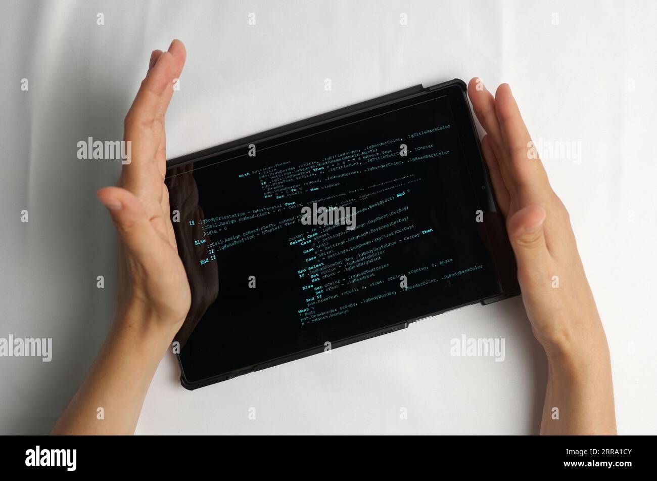 Programming and coding concept. Program code creation: hands inserting a new piece of code into the program being edited Stock Photo