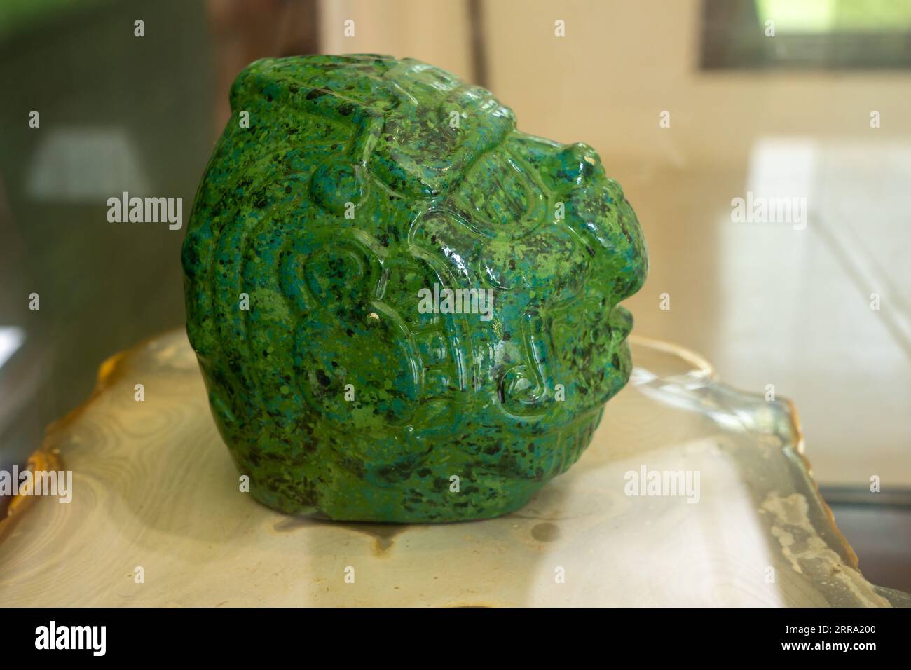 A jade sculpture of Kinich Ahau, the Mayan Sun God, in the museum at