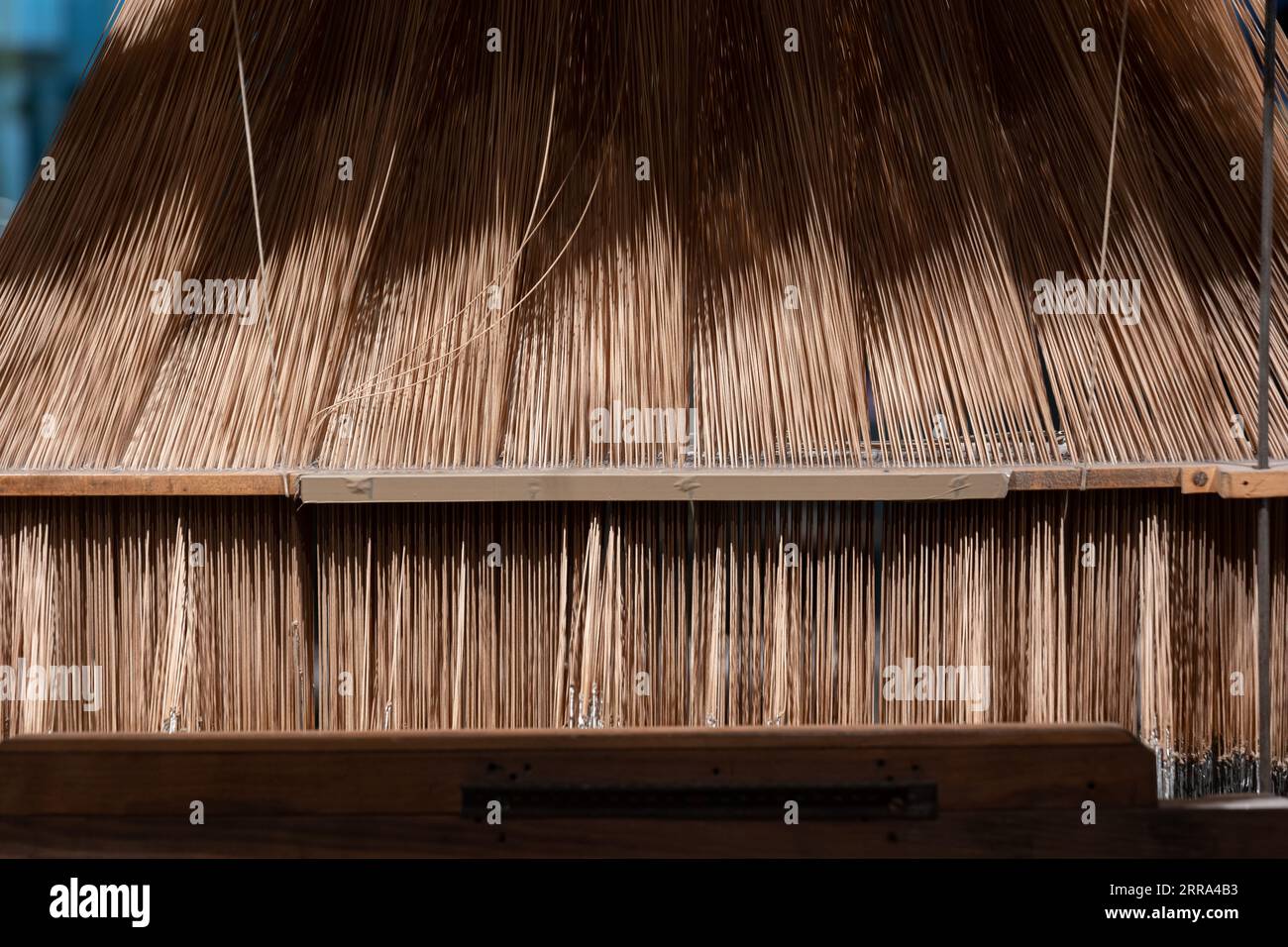 Threads of silk weaving loom with a Jacquard attachment from 19th century in National Museum of Scotland in Edinburgh, Scotland, UK. Stock Photo