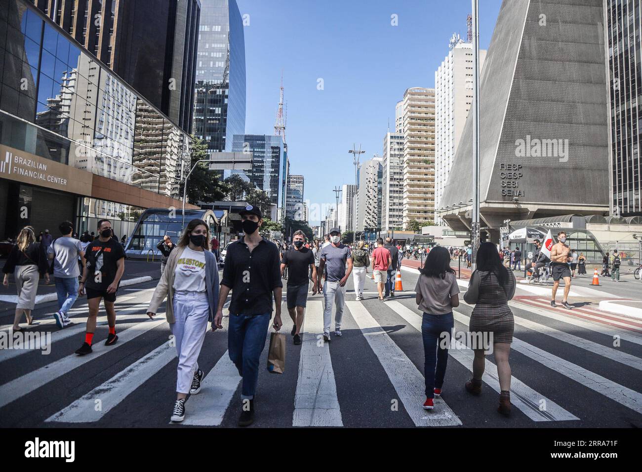 210719 -- SAO PAULO, July 19, 2021 -- Pedestrians walk at Paulista Avenue  amid COVID-19 outbreak in Sao Paulo, Brazil on July 18, 2021. The city on  Sunday reopened the pedestrian promenade