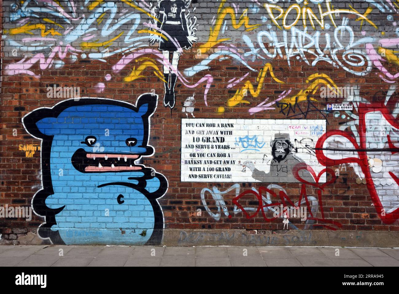 Grafitti or Wall Painting Referencing & with a Verse, Expression, Phrase or Slogan About the Work of Banksy in the Baltic Triangle Area Liverpool UK Stock Photo
