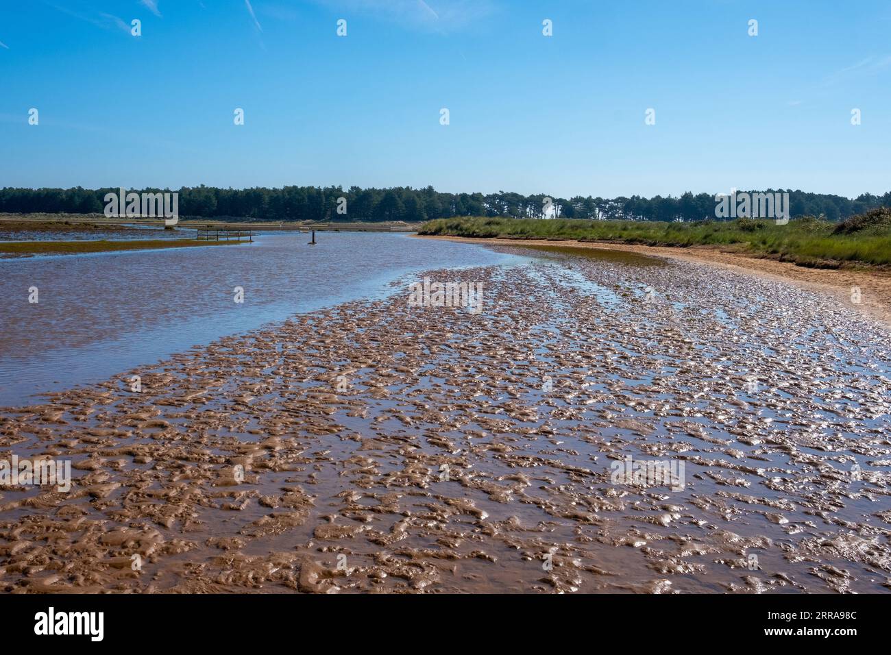 Blue sky and tidal pools at high water on Holkham Beach, Norfolk, UK, on Tuesday, September 5, 2023. Photographer: Bryn Colton Stock Photo