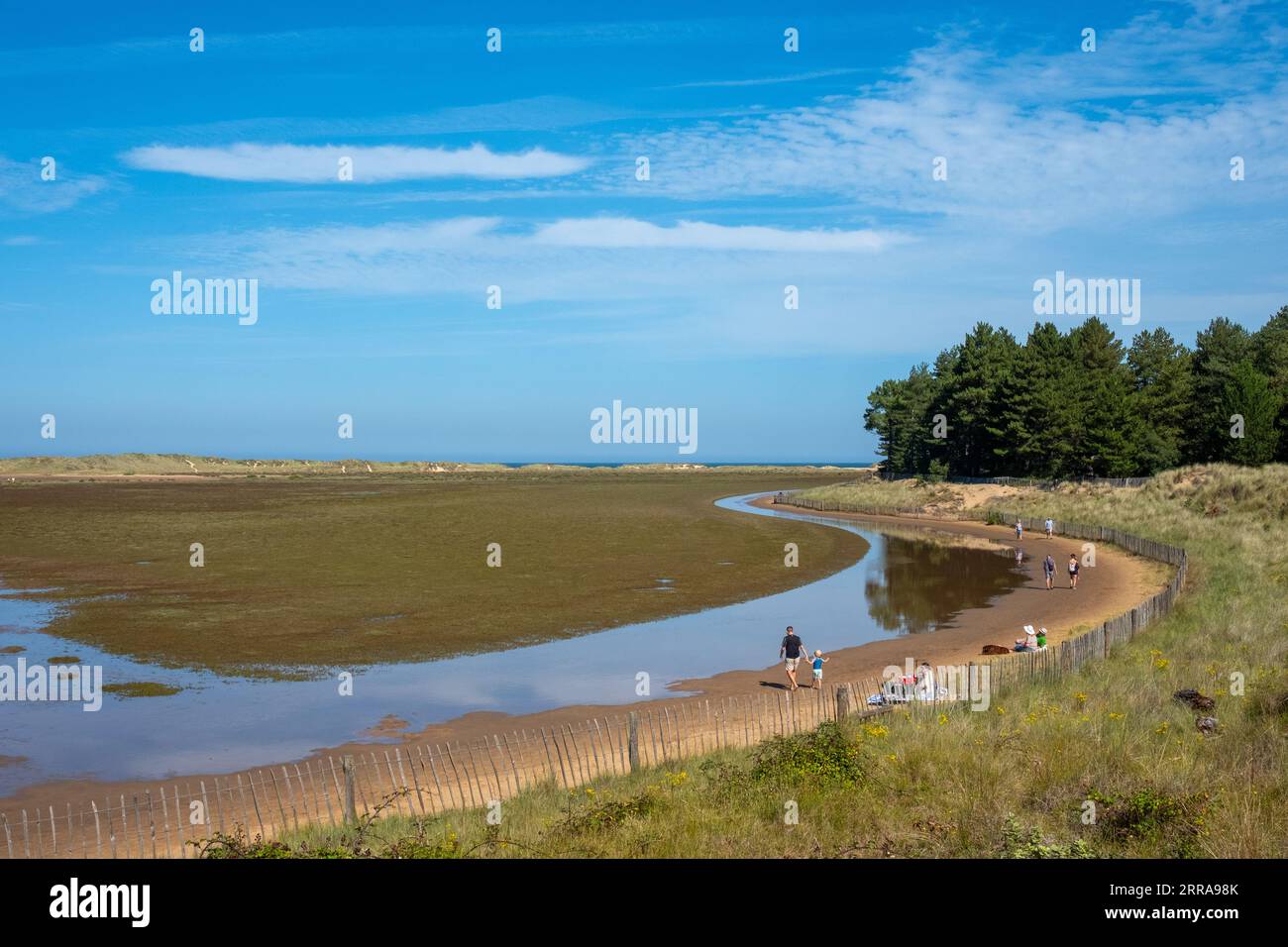 Blue sky and tidal pools at high water on Holkham Beach, Norfolk, UK, on Tuesday, September 5, 2023. Photographer: Bryn Colton Stock Photo
