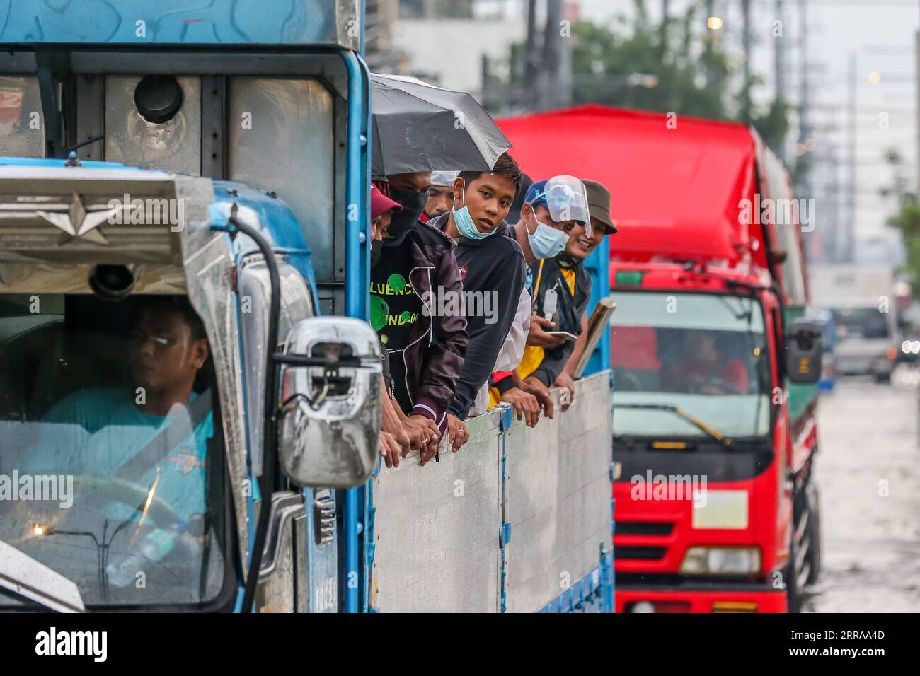 210724 -- RIZAL PROVINCE, July 24, 2021 -- People are seen onboard a truck to avoid the flood brought by heavy monsoon rains in Rizal Province, the Philippines, July 24, 2021. The Philippines have evacuated more than 15,000 people in Metro Manila and some parts of the country amid flood threat, disaster management authorities said on Saturday.  PHILIPPINES-RIZAL PROVINCE-MONSOON FLOODS RouellexUmali PUBLICATIONxNOTxINxCHN Stock Photo