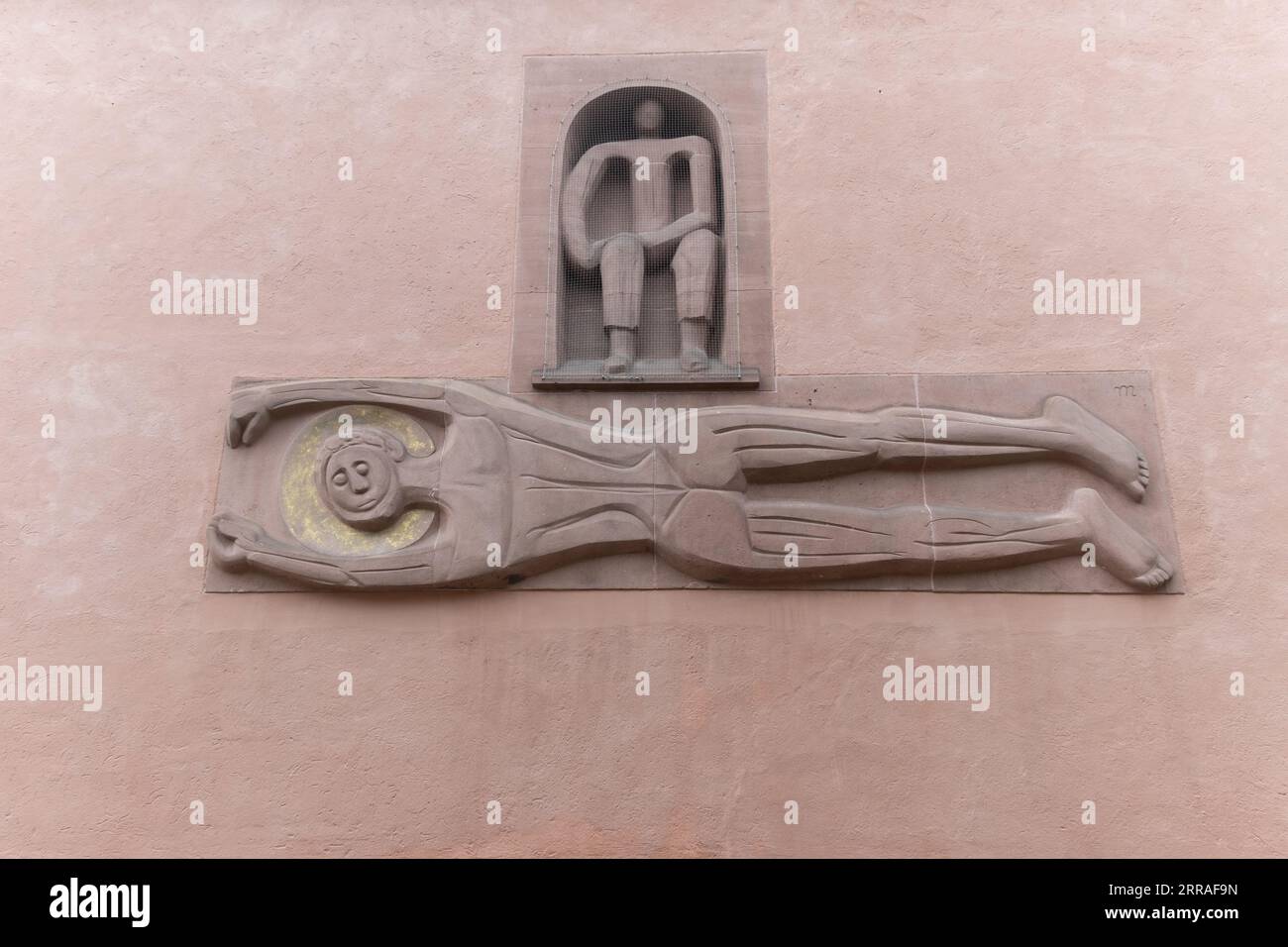 Sculpture of Saint Bartholomew on the exterior wall of the Cathedral in Frankfurt, Germany Stock Photo