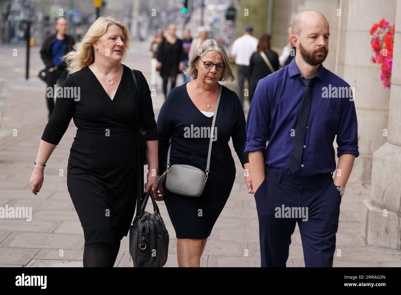 Diane Stuchbury (centre), widow of Christopher Stuchbury, with son Neil, and solicitor Lisa Gregory, at the High Court in Aberdeen, where Network Rail admitted health and safety failings over over the Stonehaven rail crash. Train driver Brett McCullough, 45, conductor Donald Dinnie, 58, and passenger Christopher Stuchbury, 62, died in the crash near Stonehaven, Aberdeenshire, on August 12, 2020. Picture date: Thursday September 7, 2023. Stock Photo