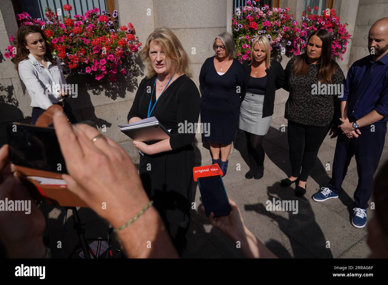 Diane Stuchbury (left), widow of Christopher Stuchbury, with family members Karen (second left), Lyndsey and Neil, listen to solicitor Lisa Gregory make a statement, at the High Court in Aberdeen, where Network Rail admitted health and safety failings over over the Stonehaven rail crash. Train driver Brett McCullough, 45, conductor Donald Dinnie, 58, and passenger Christopher Stuchbury, 62, died in the crash near Stonehaven, Aberdeenshire, on August 12, 2020. Picture date: Thursday September 7, 2023. Stock Photo