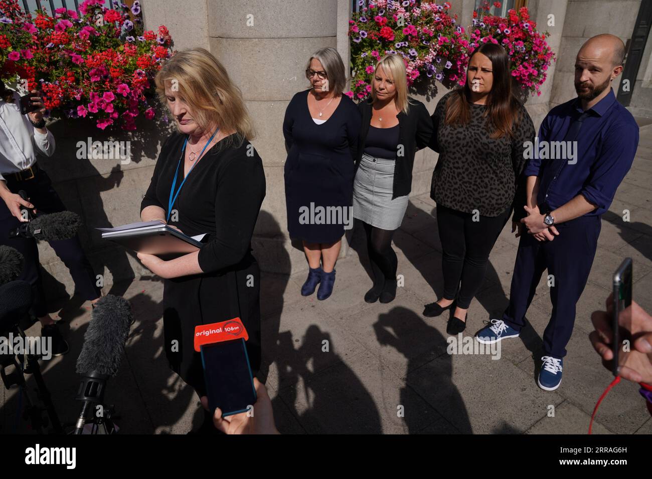 Diane Stuchbury (left), widow of Christopher Stuchbury, with family members Karen (second left), Lyndsey and Neil, listen to solicitor Lisa Gregory make a statement, at the High Court in Aberdeen, where Network Rail admitted health and safety failings over over the Stonehaven rail crash. Train driver Brett McCullough, 45, conductor Donald Dinnie, 58, and passenger Christopher Stuchbury, 62, died in the crash near Stonehaven, Aberdeenshire, on August 12, 2020. Picture date: Thursday September 7, 2023. Stock Photo