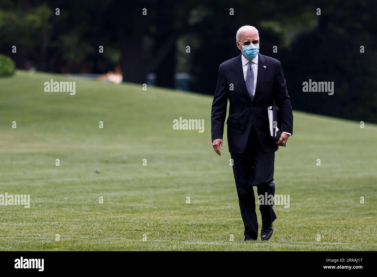 210802 -- WASHINGTON, Aug. 2, 2021 -- U.S. President Joe Biden returns to the White House after spending the weekend in Camp David, in Washington, D.C., the United States, on Aug. 2, 2021. The White House said on Monday that the U.S. Centers for Disease Control and Prevention CDC does not have the legal authority to renew an eviction ban to prevent millions of American renters of being forced from their homes during the re-surging of the coronavirus pandemic. U.S. President Joe Biden on Monday called on all states and cities to extend or put in place policies to freeze evictions for at least t Stock Photo