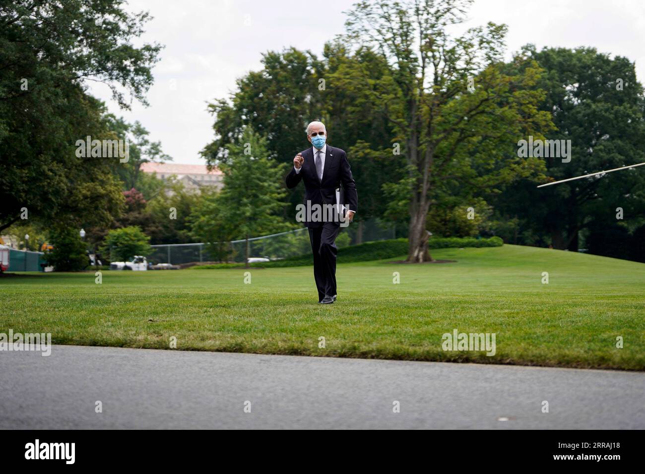 210802 -- WASHINGTON, Aug. 2, 2021 -- U.S. President Joe Biden returns to the White House after spending the weekend in Camp David, in Washington, D.C., the United States, on Aug. 2, 2021. The White House said on Monday that the U.S. Centers for Disease Control and Prevention CDC does not have the legal authority to renew an eviction ban to prevent millions of American renters of being forced from their homes during the re-surging of the coronavirus pandemic. U.S. President Joe Biden on Monday called on all states and cities to extend or put in place policies to freeze evictions for at least t Stock Photo