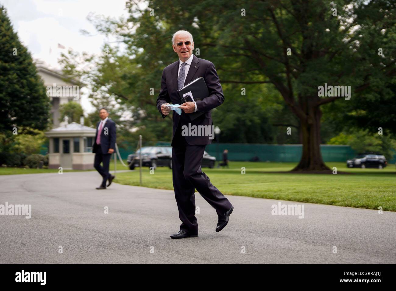 210802 -- WASHINGTON, Aug. 2, 2021 -- U.S. President Joe Biden Front returns to the White House after spending the weekend in Camp David, in Washington, D.C., the United States, on Aug. 2, 2021. The White House said on Monday that the U.S. Centers for Disease Control and Prevention CDC does not have the legal authority to renew an eviction ban to prevent millions of American renters of being forced from their homes during the re-surging of the coronavirus pandemic. U.S. President Joe Biden on Monday called on all states and cities to extend or put in place policies to freeze evictions for at l Stock Photo