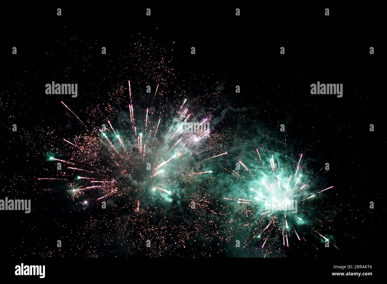 Fireworks in the black night sky Stock Photo